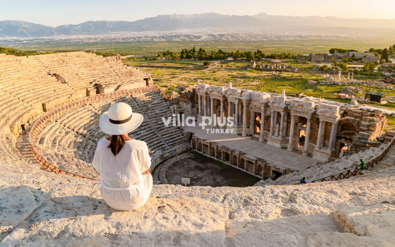 a woman sitting at the amphitheatre
